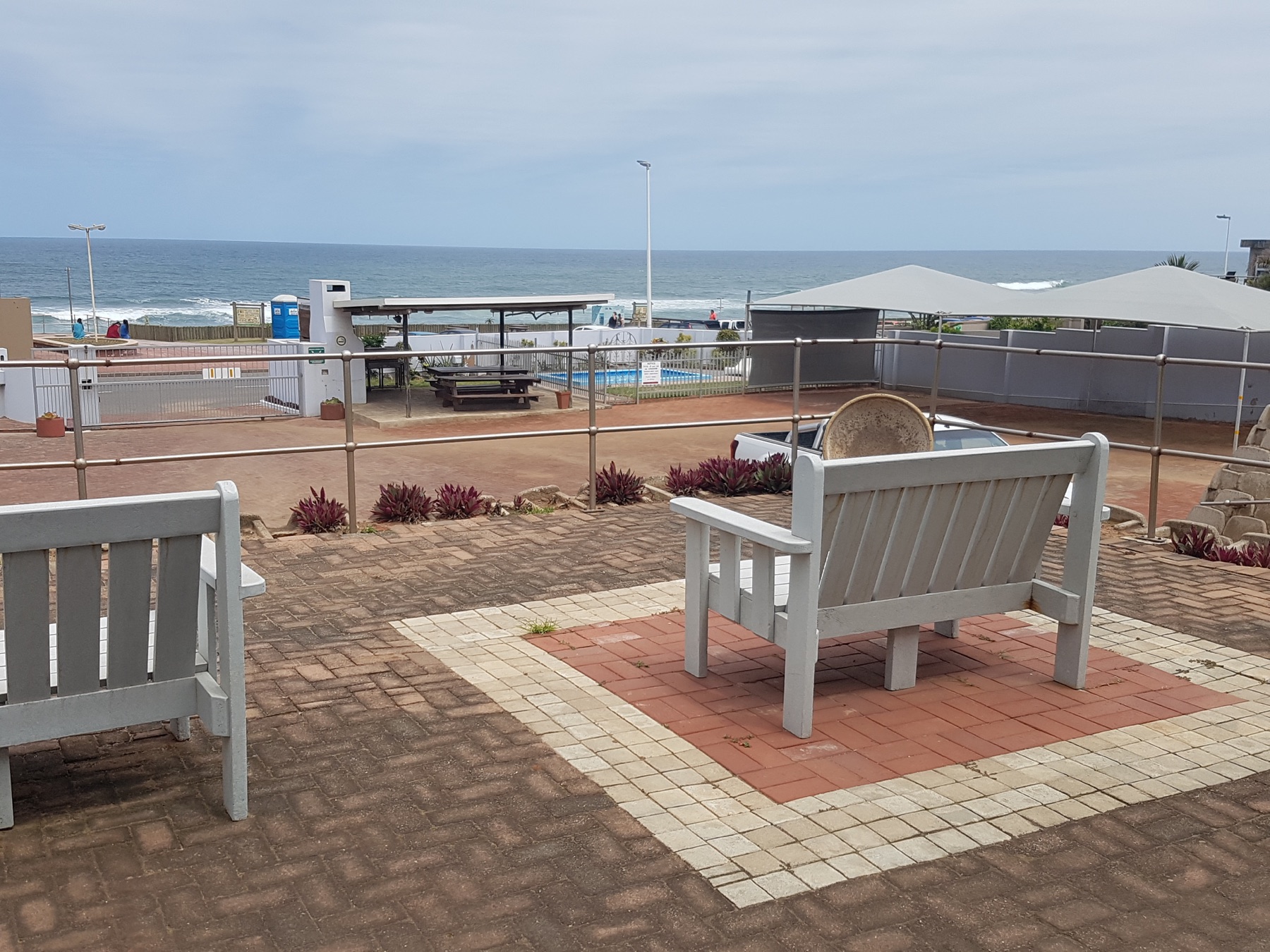 Patio seating at 4Shore Guesthouse overlooking the ocean